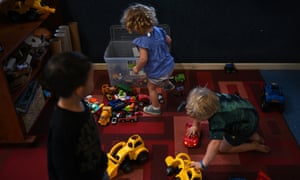 Three children play at a childcare centre