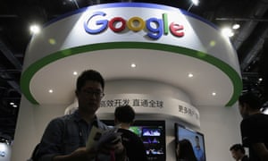 Visitors gather at a display booth for Google at a 2016 conference in Beijing.