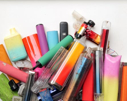 A ollection of discarded electronic cigarette vapes and internal components