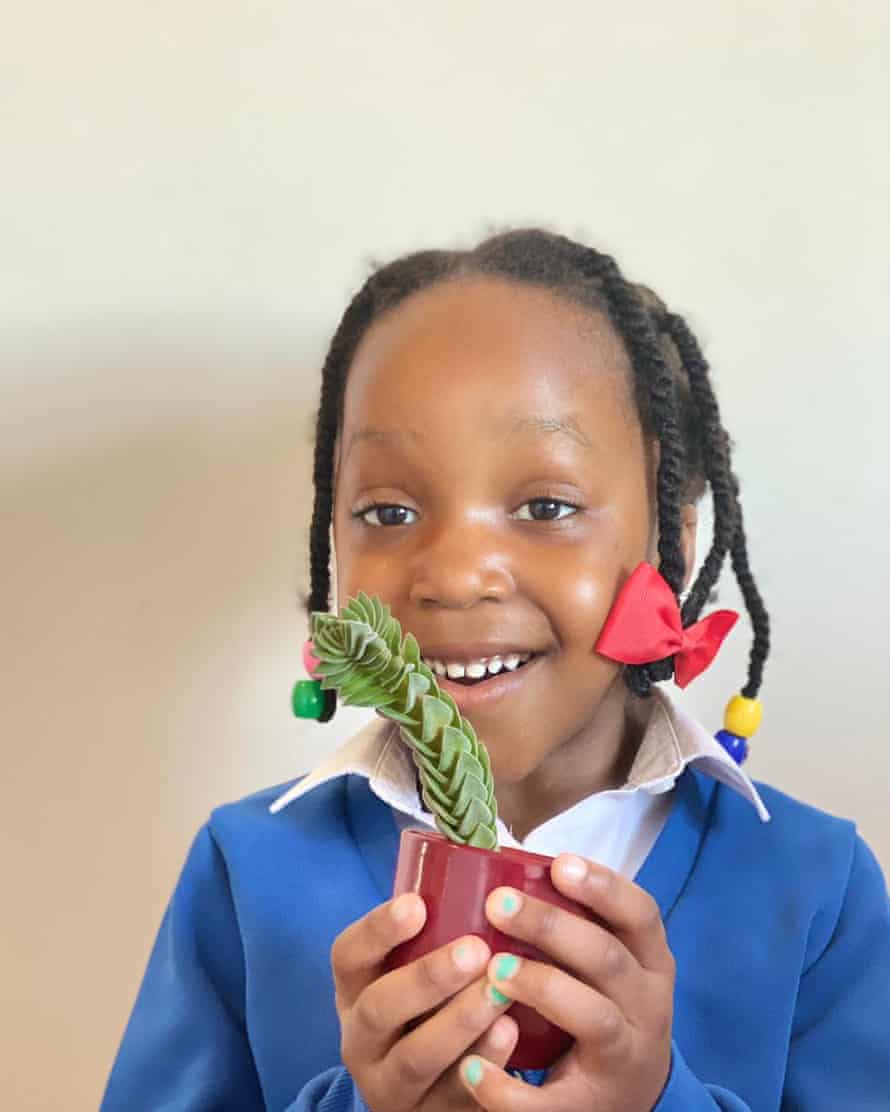 Nmeso with a plant she chose herself.