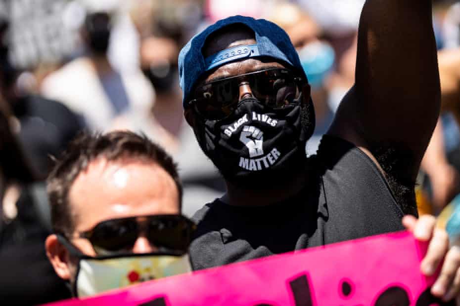 A man in a Black Lives Matter mask attends a protest in Los Angeles on 14 June 2020.