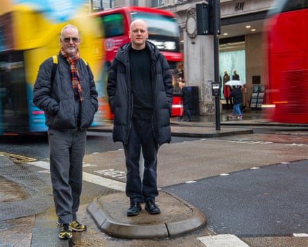 Two men stand in Oxford Street