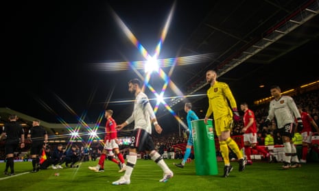 Bruno Fernandes of Manchester United leads out his teammates prior to the Carabao Cup Semi Final 1st Leg match between Nottingham Forest and Manchester United.