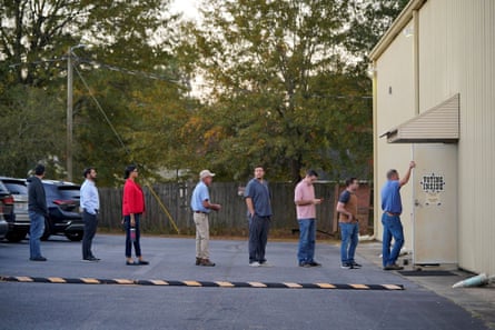 Local residents wait in line to cast their ballots during the midterm elections at the Central Baptist church in Columbus, Georgia, on 8 November 2022.