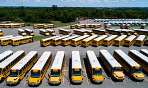 School buses parked in Leesburg, Virginia. Most vulnerable to state K-12 education cuts are school districts that serve students from low-income communities.