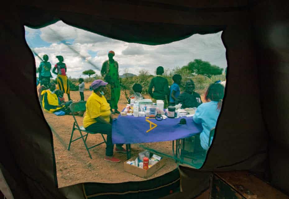 When the camels arrive, health workers set up tables and tents for a mobile clinic.