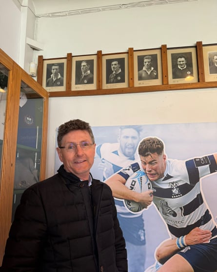 Dan Drysdale’s grandson, Malcolm, stands beneath a photograph (third from left) of the former Scotland full-back.