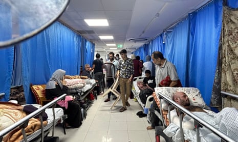 Patients and internally displaced people at al-Shifa hospital in Gaza, 10 November 2023.
