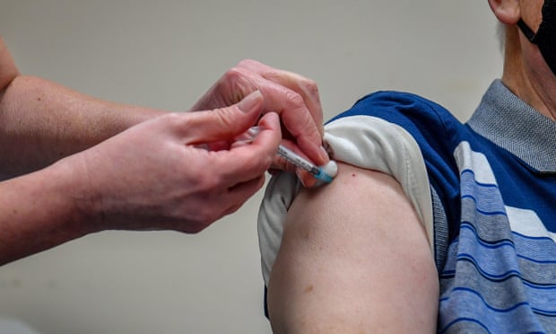 Man receiving a Covid-19 vaccine