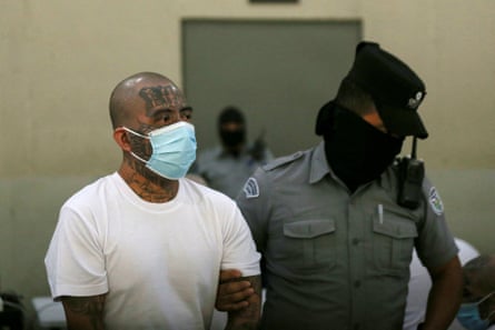 a man holding another man’s arm