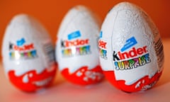 Three Kinder Surprise eggs in red and white foil with colourful lettering