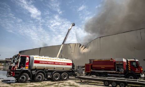 Officials conduct debris removal work and battle to put out the flames as four people were wounded according to military governor following a Russian missile attack in Odesa, Ukraine on June 24.
