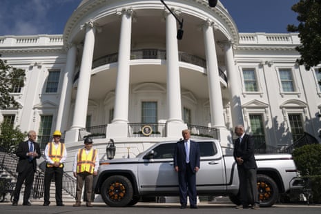 Donald Trump poses with the Lordstown Motors CEO, Steve Burns, and workers at the White House last month. The company has taken over a GM plant that closed the day Trump was inaugurated but employs only a fraction of the workers GM did.