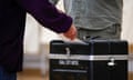 A voter casts his ballot in black box marked ballot box