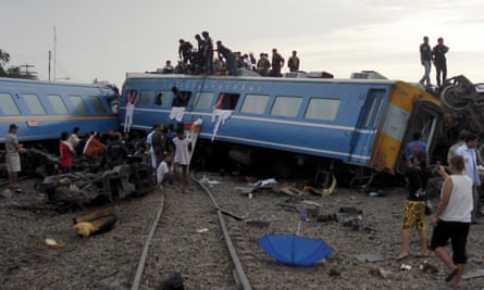 Rescuers on the derailed train carriages in Hua Hin.