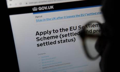Advice on Applying to the EU Settlement Scheme seen through a magnifying glass on the UK government website2APGR0G Advice on Applying to the EU Settlement Scheme seen through a magnifying glass on the UK government website