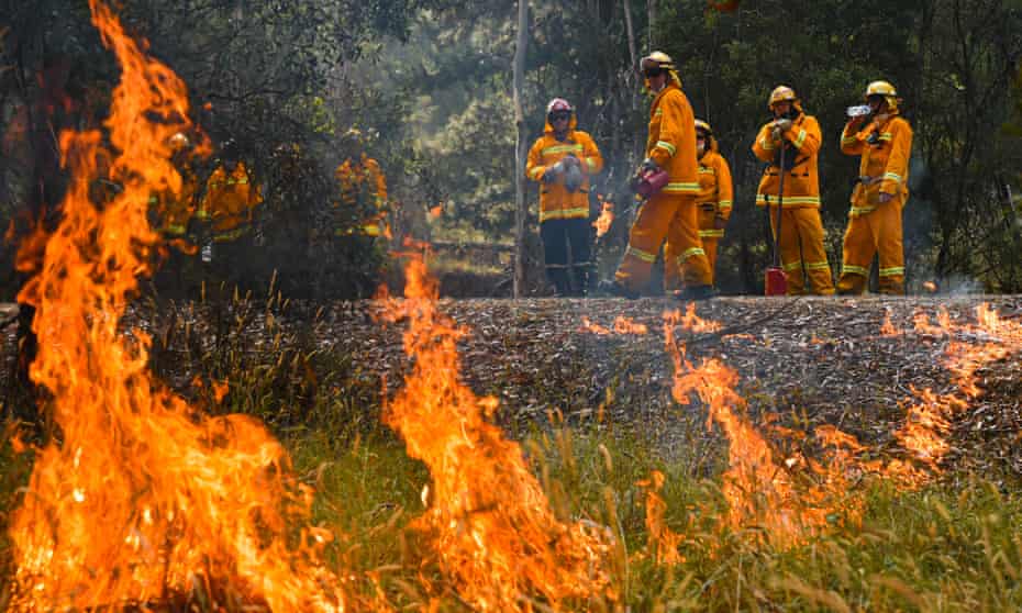 Country Fire Authority strike teams performing controlled burning west of Corryong, Victoria. The Corryong fire has begun to merge with a bushfire in the NSW southern highlands
