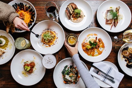 On a shot taken from above, a table can be seen with lots and lots of meals on it.