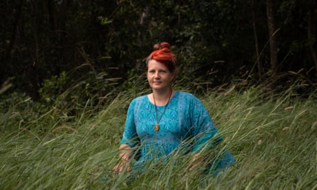 Broken Head, NSW, Australia. A portrait of Mirabai Nicholson-McKellar (aged 37 years) on her brothers property in Broken Head, NSW. Mirabai caught covid while overseas in Germany in March of 2020 and has since developed been suffering from a complex range of symptoms refered to as "long covid". It has been very difficult for her to gain access to treatment and to find professionals who understand her situation. February 5, 2022. David Maurice Smith.
