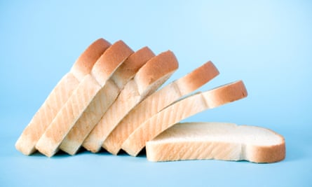 Slices of white bread on a blue background