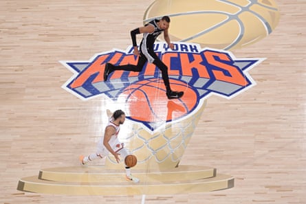 The Knicks’ Jalen Brunson moves the ball downcourt as the Spurs’ Victor Wembanyama looks on during Game 4.