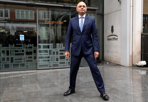 Sajid Javid stands outside the Home Office after being named home secretary. With his legs really wide apart.