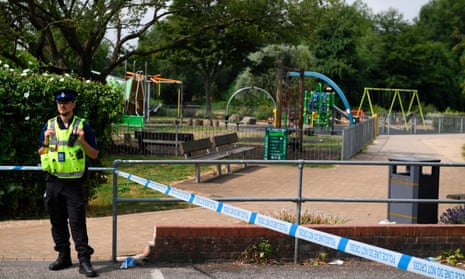 A police officer stands at a cordon by a park at Queen Elizabeth Gardens in Salisbury.