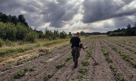 ‘When I am digging, I am escaping’: Piotr scours a field for buried treasure of the wars past.