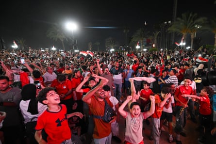 Fans in Cairo celebrate after the win over Australia in the last 32