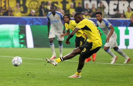 Borussia Dortmund's Serhou Guirassy scores their third goal from the penalty spot.