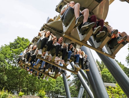 Visitors hang beneath the Nemesis rollercoaster ride at Alton Towers in 2017