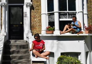 Enjoying the weather on window ledges and doorsteps in north London