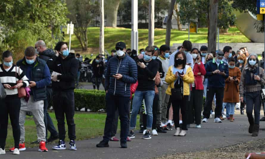 People queue to receive their Covid jab at the mass vaccination hub at Olympic Park in Sydney. Pfizer vaccines vastly outnumber AstraZeneca doses that are administered at the hub.