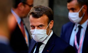 French President Emmanuel Macron leaving the European Council building in the early morning