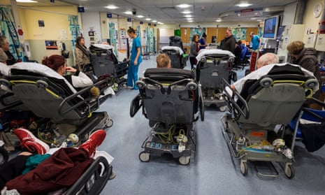 Hospital A&E packed with patients on trolleys and chairs