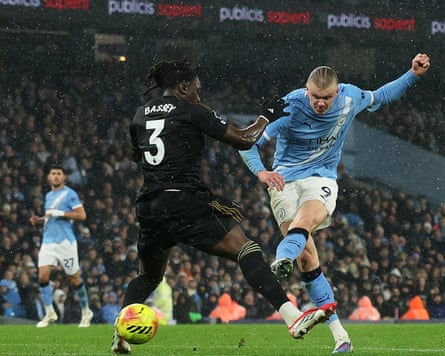 Erling Haaland scores for Manchester City in the Premier League against Fulham, nutmegging Fulham defender Calvin Bassey in the process.