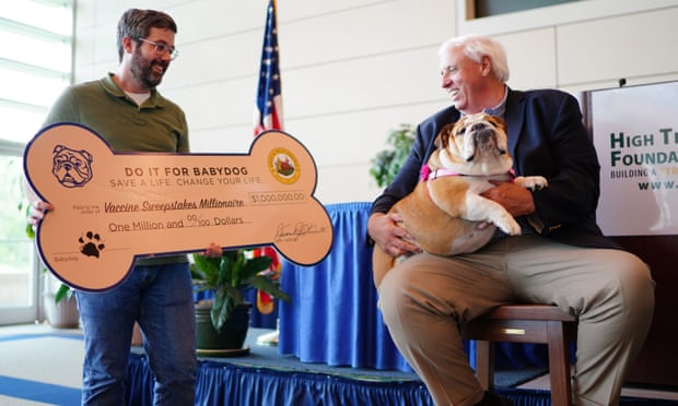 Governor Jim Justice presents Timothy Jackson, the latest million-dollar winner in West Virginia’s vaccination sweepstakes, with a check on 14 July.