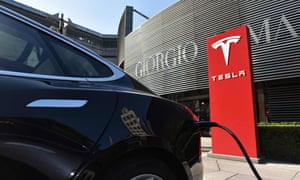 A Tesla car at charging station outside a shopping mall in Beijing.