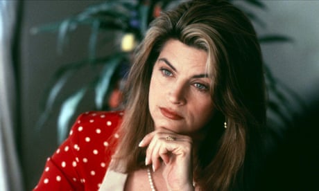 Kirstie Alley looking thoughtful and resting her chin on her hand