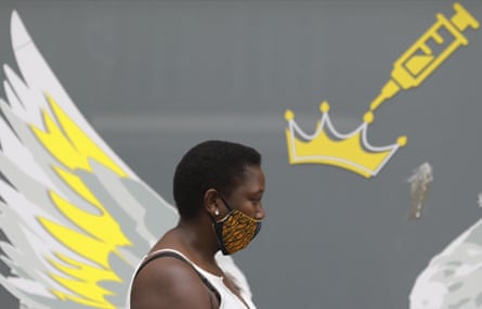 A woman wears a mask to protect against coronavirus, Cape Town, South Africa