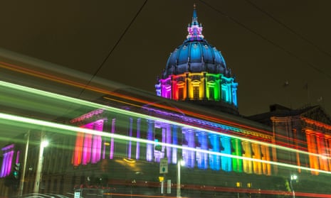San Francisco City Hall lit with rainbow lights for Pride, USA.
