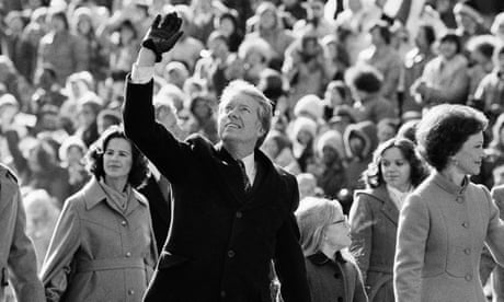 FILE - In this Thursday, Jan. 20, 1977 file photo, President Jimmy Carter waves to the crowd while walking with his wife, Rosalynn, and their daughter, Amy, along Pennsylvania Avenue from the Capitol to the White House following his inauguration in Washington. On Wednesday, Aug. 12, 2015, Carter announced he has cancer and will undergo treatment at an Atlanta hospital. (AP Photo/Suzanne Vlamis)