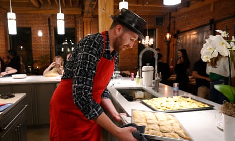 Rabbi Ben Gorelick prepares food for a Sacred Tribe community dinner at his home in Denver.