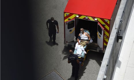 A man arrives at Houston Methodist hospital emergency room on a stretcher in June.