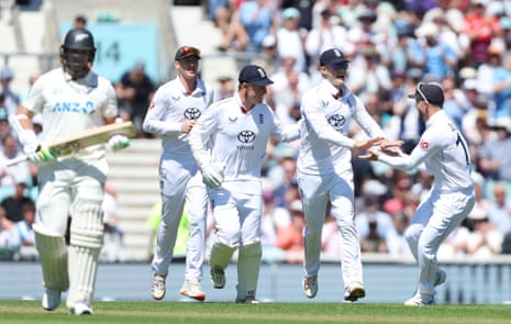 Jacob Bethell of England celebrates taking the catch to dismiss Tom Latham.