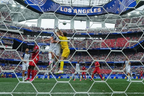 Bosnia and Herzegovina goalkeeper Nikola Vasilj punches clear.