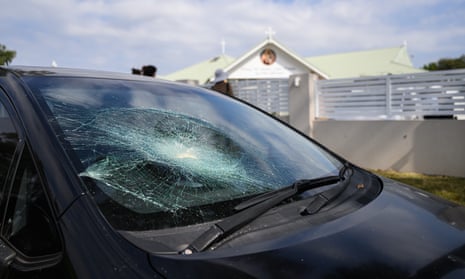 A damaged car parked outside Christ The Good Shepherd Church.
