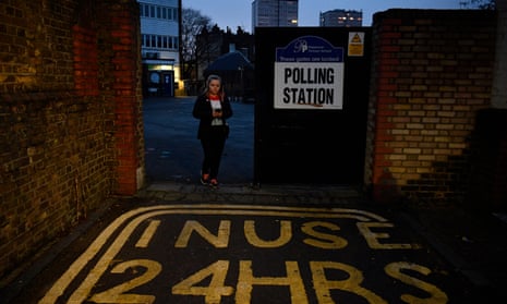 A voter leaves a polling station during the general elections in London