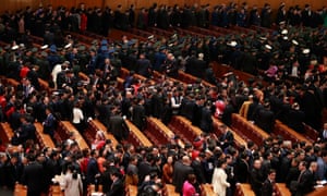 Delegates line up to leave the hall after the opening of the second session of the 13th National People’s Congress (NPC) outside the Great Hall of the People in Beijing, China, 5 March 2019.