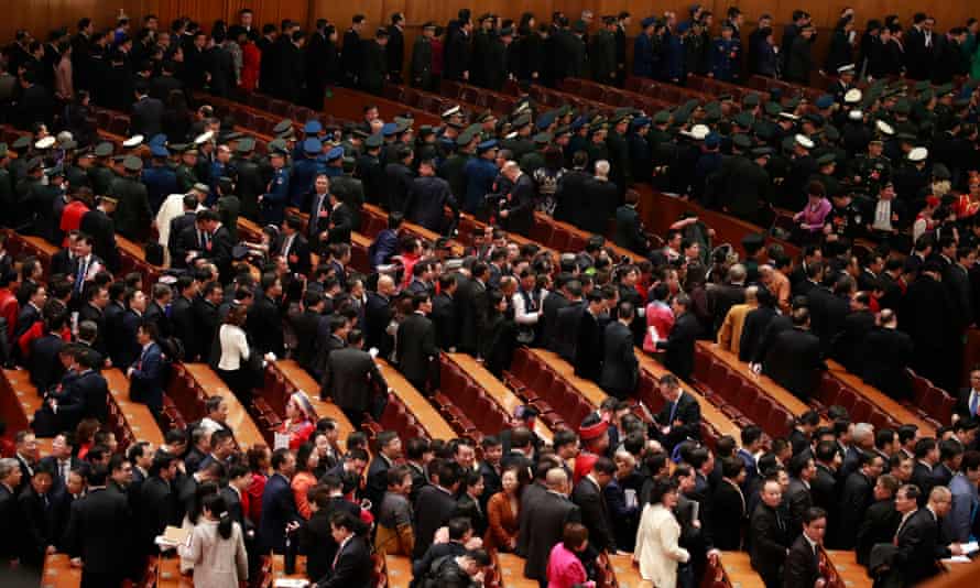 Delegates line up to leave the hall after the opening of the second session of the 13th National People’s Congress (NPC) outside the Great Hall of the People in Beijing, China, 5 March 2019.